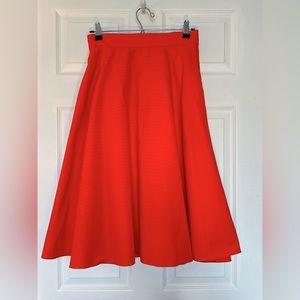 Uniqlo summer midi circle skirt with pockets vibrant orange.